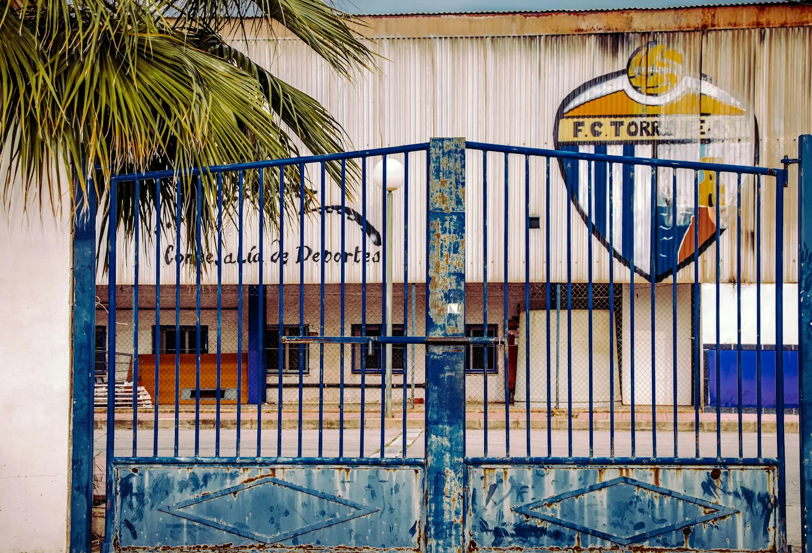 A metal gate in front of a building