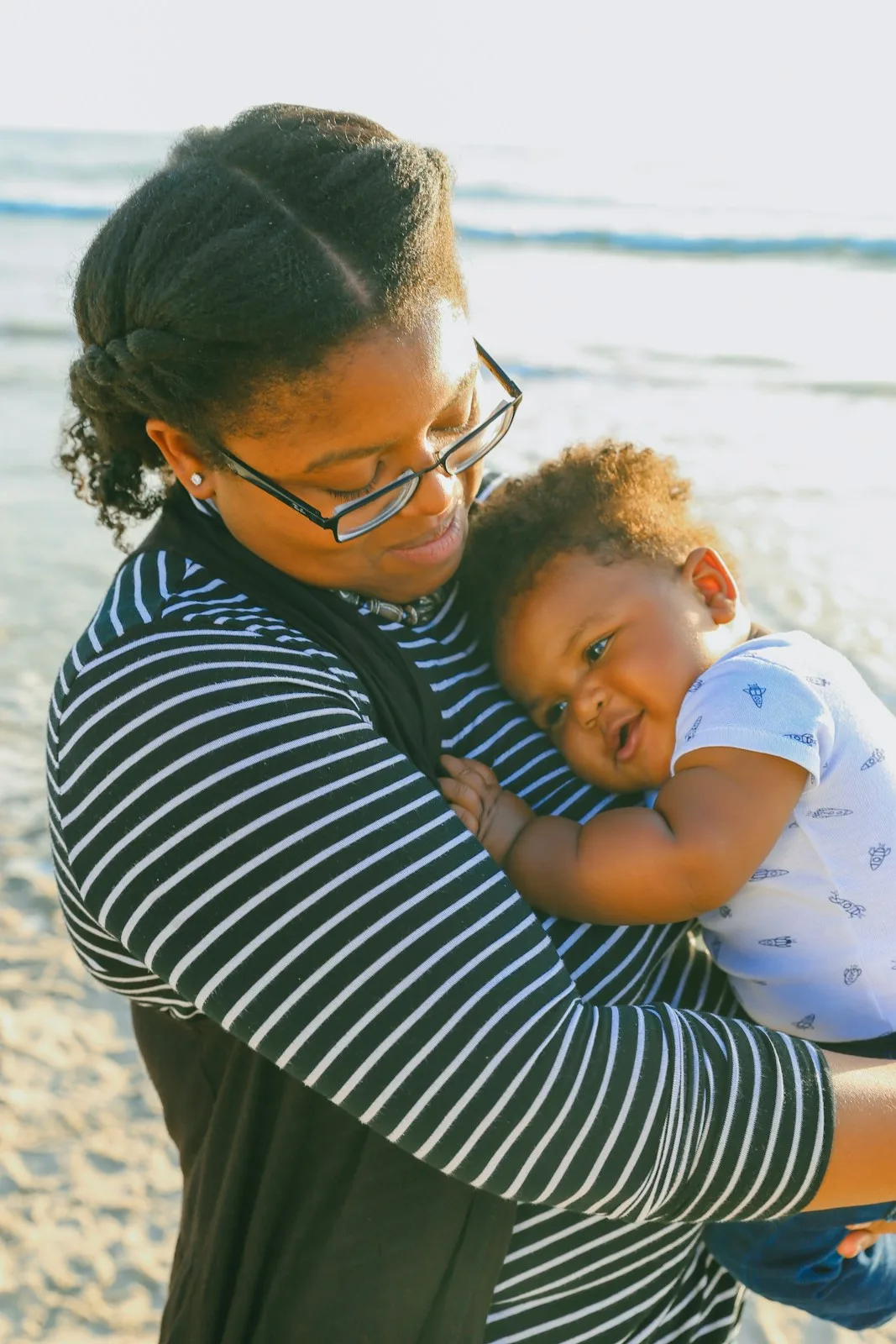 A carer cuddling a baby